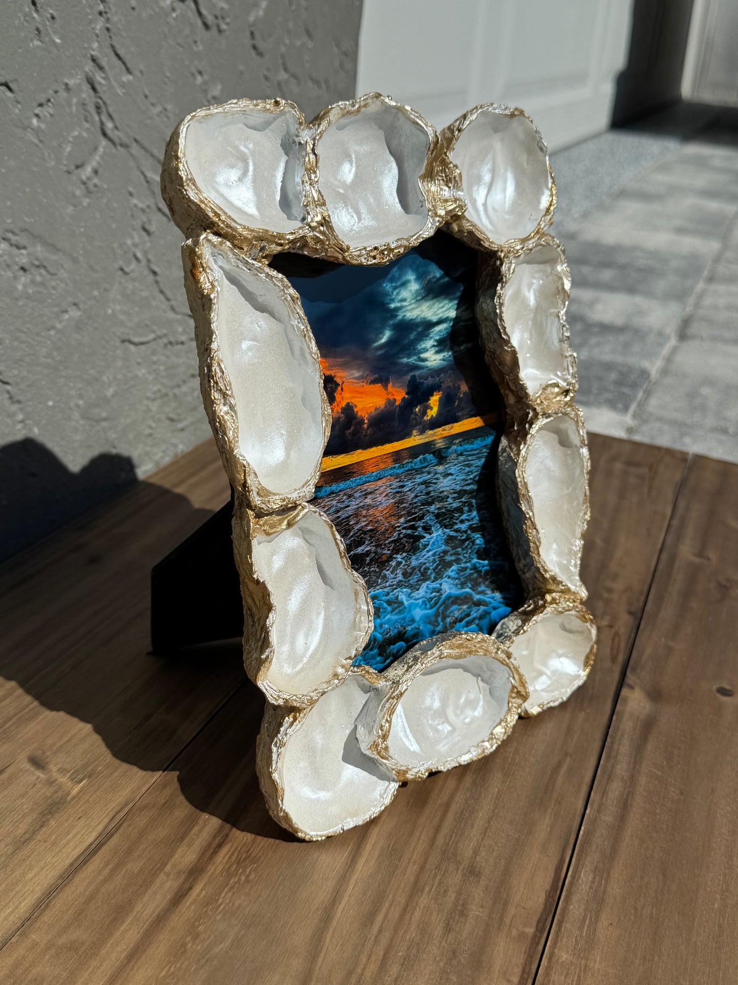 Moody Sunrise in Gold Rimmed Oyster Shell Frame